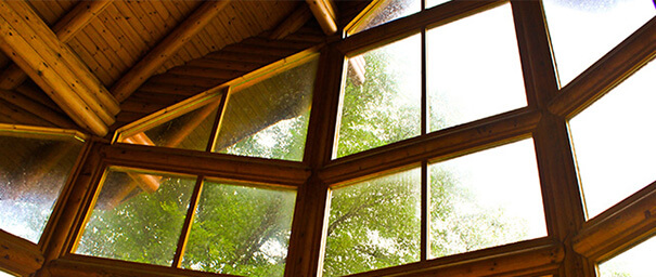 A picture of a wood-framed window taken from an upward angle.