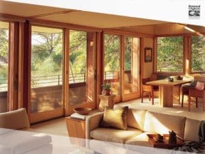 Warm home interior with natural wood sliding glass doors from Renewal by Andersen